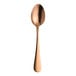 A Varick Fulton vintage copper dessert spoon with a wooden handle.