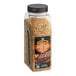 A jar of McCormick Grill Mates Cracked Black Pepper and Garlic with Sea Salt Seasoning on a table with a label.