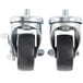 A pair of Traulsen stem casters with black rubber wheels and nuts.