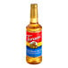 A 750 mL plastic bottle of Torani Salted Honey Butter syrup with a red label.