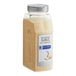 A clear plastic container of McCormick Culinary Granulated Garlic with a white label.