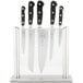 A Mercer Culinary Renaissance knife set in a glass block holder.