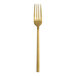 A gold Varick Lissome dinner fork with a white background.