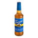 A Torani Sugar-Free Peanut Butter Cup flavoring syrup in a plastic bottle with a blue label.