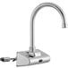 A silver Waterloo wall-mount hands-free sensor faucet with a chrome gooseneck spout and black sensor button.