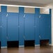 A row of blue ASI Accurate Partitions bathroom stall doors with black hardware.