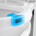 A blue Lavex Cotton Blossom scented gel toilet bowl clip with a black label.