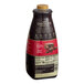 A close-up of a Torani Puremade Dark Chocolate flavoring sauce bottle.
