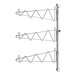 A Regency stainless steel wall-mounted rack with three shelves and single brackets.