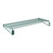 A close-up of a Regency green metal wire shelf with two brackets.
