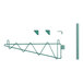 A green metal object with a metal rod and a green triangle.