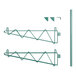 A green metal Regency wall-mount shelf post with double brackets.