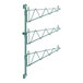 A green metal Regency wall-mount shelf post with single brackets.