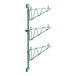 A green metal Regency wall-mount shelf post with three levels.