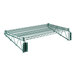 A close-up of a green metal Regency wire shelf with two metal brackets.