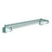 A close-up of a Regency green epoxy wall-mount wire shelf.