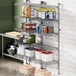 A Regency stainless steel wall-mount shelf post with single brackets for shelves.