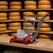 A Boska cheese dicer with a yellow and black border on a table.