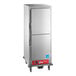 A full size insulated heated holding cabinet with solid stainless steel Dutch doors and caster wheels.