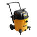 A yellow and black DeWalt wet/dry vacuum with accessory storage bag.