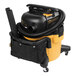 A yellow and black DeWalt wet/dry vacuum with a black accessory storage bag.