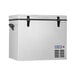 A Summit Appliance portable refrigerator/freezer with a metal door on a white cooler.