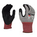 A close-up of a Cordova Tactyle cut-resistant glove with Tuf-Cor sandy nitrile coating in black and red.