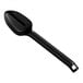 A Visions black plastic serving spoon with a handle.