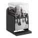 A black and silver Narvon refrigerated beverage dispenser with two containers and dispensers.