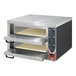 A stainless steel Sirman Vulcano double deck countertop pizza oven with shelves.