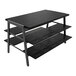 A matte black metal Econoco 3-tier display table with black woodgrain shelves.