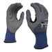 A close-up of a pair of Cordova Tactyle cut-resistant gloves with a blue and grey design.
