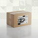 A brown cardboard box with a label for Adourne Coarse Black Sanding Sugar.