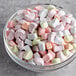 A bowl of Kraft Mini Assorted Rainbow dehydrated marshmallows.