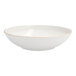 A white Nosse stoneware bowl with a gold rim.