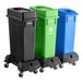 A Lavex mobile trash station with black, green, and blue lids on wheels.