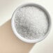 A bowl of Adourne clear white sparkling sugar.