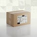 A brown cardboard box with a white label that says "Adourne Coarse White Sanding Sugar"