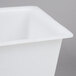 A close-up of a white square container with a lid.