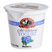 A white September Farm yogurt container with blue and purple text filled with blueberry yogurt.