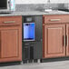 A Follett Chewblet ice maker and water dispenser on a countertop.