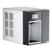 A white and black Follett countertop ice and water dispenser with a digital display and a door.