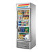 A stainless steel True merchandising refrigerator with an open glass door.