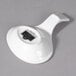 A white porcelain small spoon with a handle.