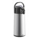 A close-up of a silver Curtis stainless steel airpot with a black lever and lid.