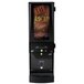 A black Curtis Cafe Series cappuccino machine with a sign that says "Rich Chocolate" on it.