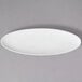 A close up of a 10 Strawberry Street white oval porcelain leaf platter.