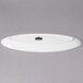 A white oval porcelain platter with leaf edges.