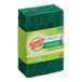 A green 3M Scotch-Brite heavy-duty scouring pad.