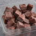 A plastic container of brown Makai Pure Organic Unsweetened Acai Blender cubes.